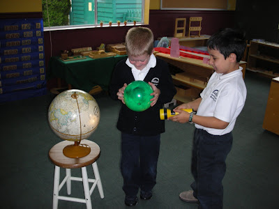 children work with globes things to love about first day of school NAMC montessori classroom