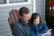 NAMC montessori classroom activities father's day reading to girl 