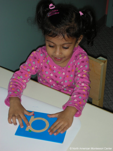 NAMC montessori education from concrete to abstract girl sandpaper letters