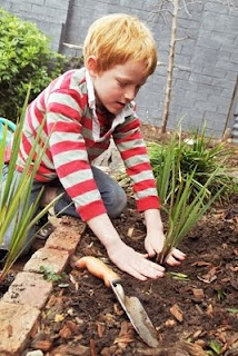 NAMC montessori grace and courtesy learning through community service child gardening