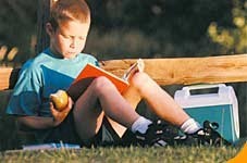 NAMC montessori language arts summer time boy reading