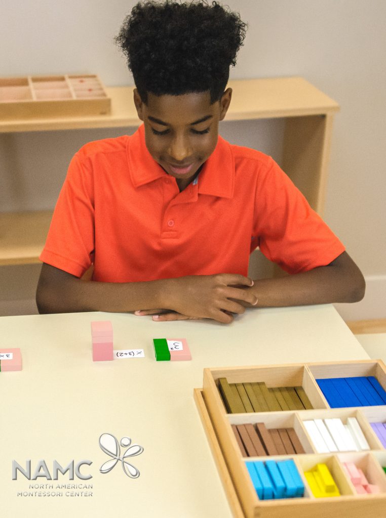 Montessori upper elementary student working with cubing material