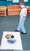 NAMC montessori activities developing presenting around student interests walking around the mat