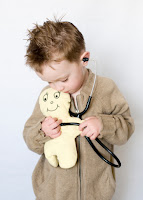NAMC montessori first plane of development and imagination boy with doll