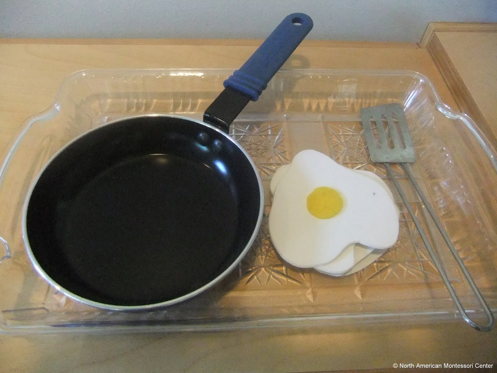 NAMC montessori preschool classroom Easter curriculum activities egg flipping