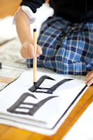 NAMC montessori student learning japanese calligraphy golden week classroom activies