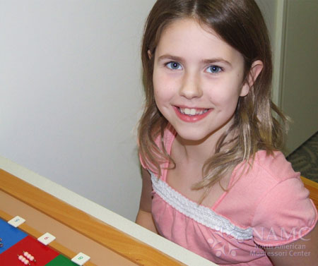 NAMC montessori math favorite lower elementary material checkerboard smiling girl