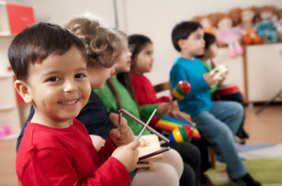 NAMC montessori activities hanukkah 8 days crafts snacks culture children playing instruments
