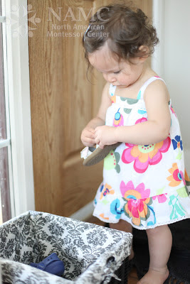 NAMC celebrating montessori week with montessori in our home being a montessori family girl putting away shoes