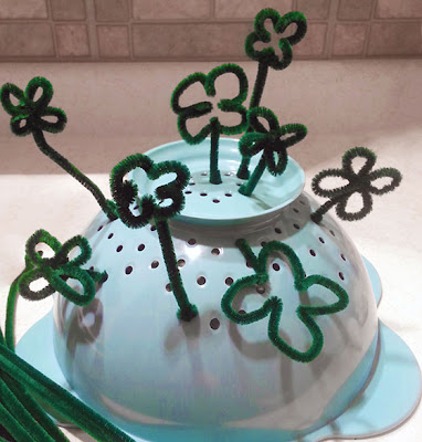 NAMC st. patrick's day montessori activities fine motor skills pipe cleaner colander lucky clover garden