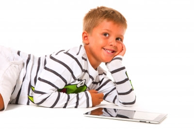 NAMC Montessori classroom computer applications boy using tablet app