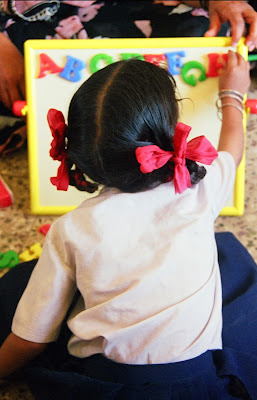 NAMC Montessori's sensitive period for order girl organizing letters