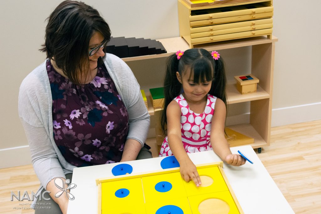 Montessori teacher and child working with circles from the Geometric Cabinet