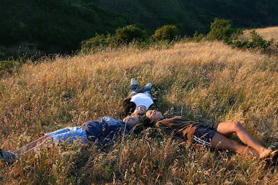 NAMC montessori adolescent programs erdkinder teens laying in field