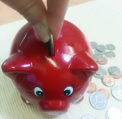 NAMC montessori practical life coin activities money in the classroom pincer grip piggy bank