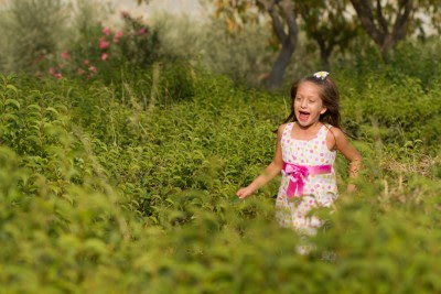 NAMC international montessori congress origins and potential activities girl running in field