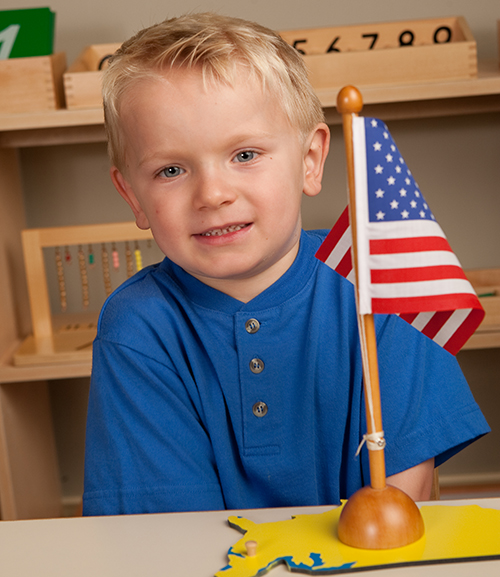 namc montessori fourth of july us flag building and counting boy with flag
