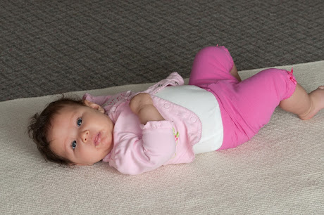 NAMC montessori infant toddler environment preparing for movement laying on a mat