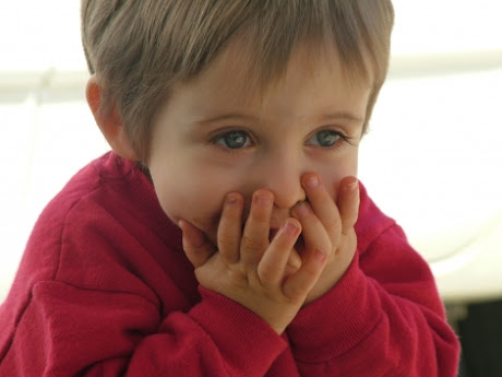 NAMC encouraging quiet in the montessori environment boy covering mouth