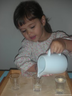 namc adding variety montessori practical life girl pouring water