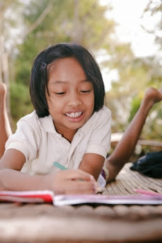 NAMC montessori language arts preschool to elementary young girl writing