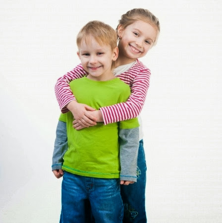 namc montessori encouraging positive behavior girl and boy hugging 