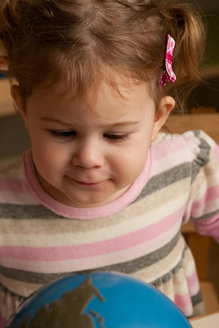 NAMC Montessori circle time song cosmic education this pretty planet girl with globe