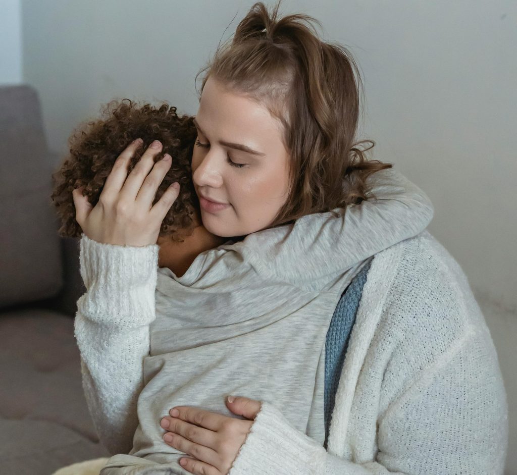 mother hugging child