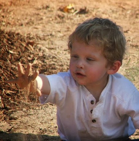 namc montessori sensorial work with soil exploring earth boy with dirt
