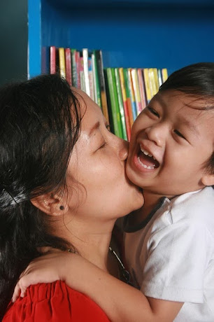 namc montessori having your own child in your classroom mother and son hugging