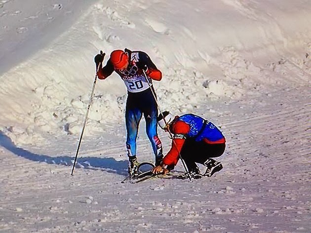 NAMC Montessori values olympic spirit coach helps skier on hill