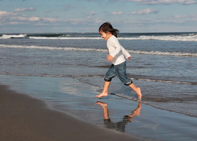 NAMC montessori psychic developing personality early childhood girl running on beach