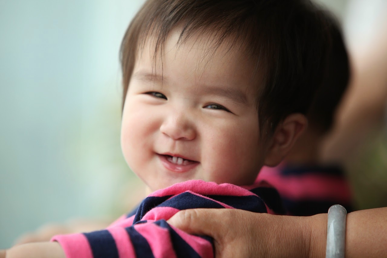 NAMC Montessori interaction infants childhood development smiling baby