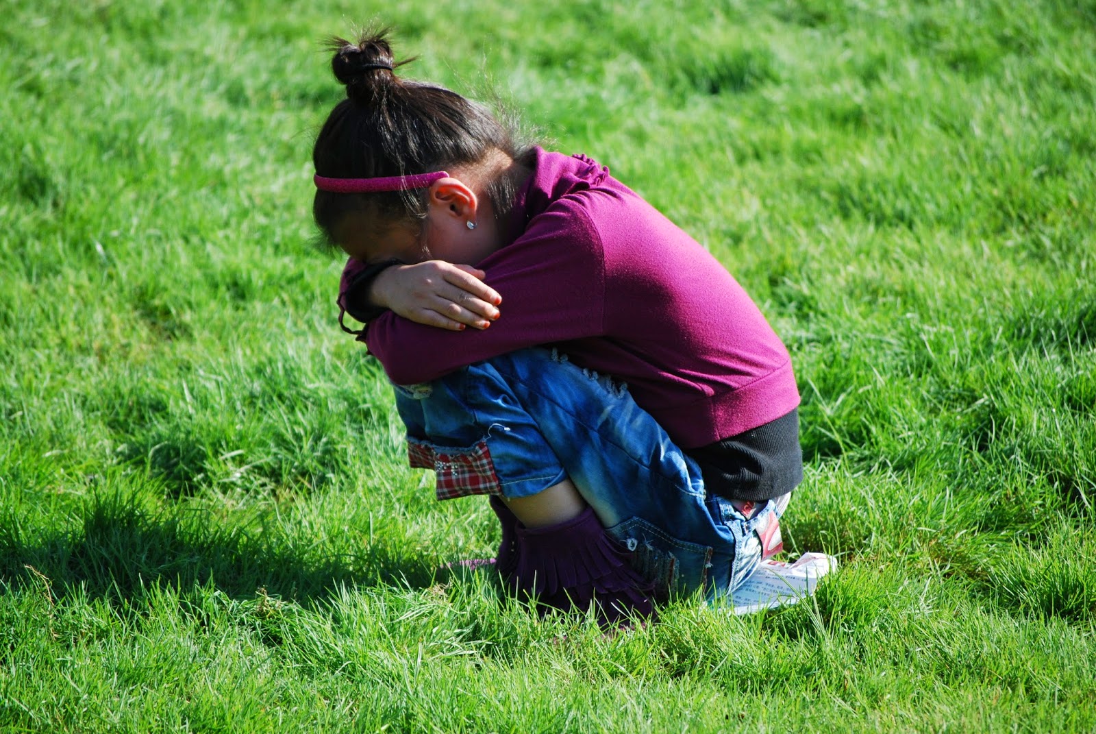 NAMC montessori developing sense of fairness girl crouching crying