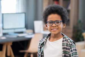 Montessori elementary student facing camera