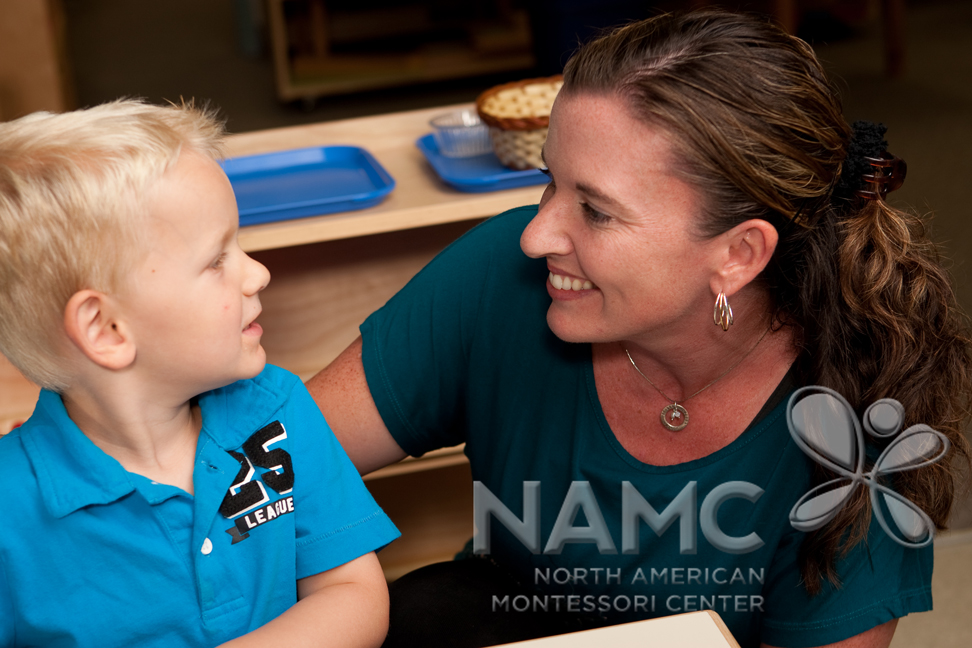 NAMC Montessori Twenty Years teacher and child smiling