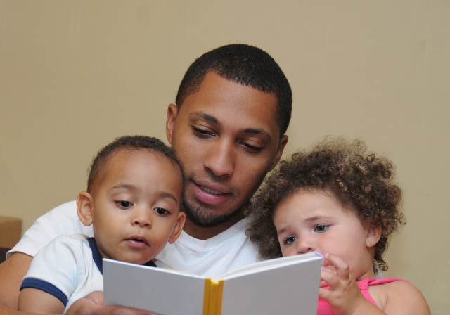 NAMC Montessori Absorbent Mind Chapter 28 Love and Its Source the Child. dad reading to children