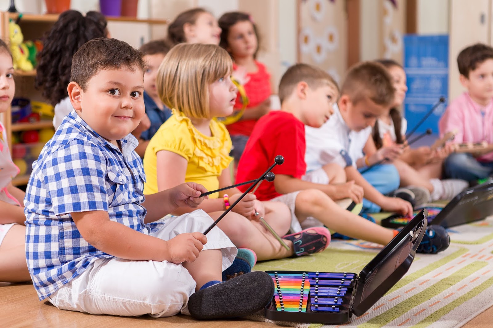 NAMC montessori early childhood music development children playing instruments.