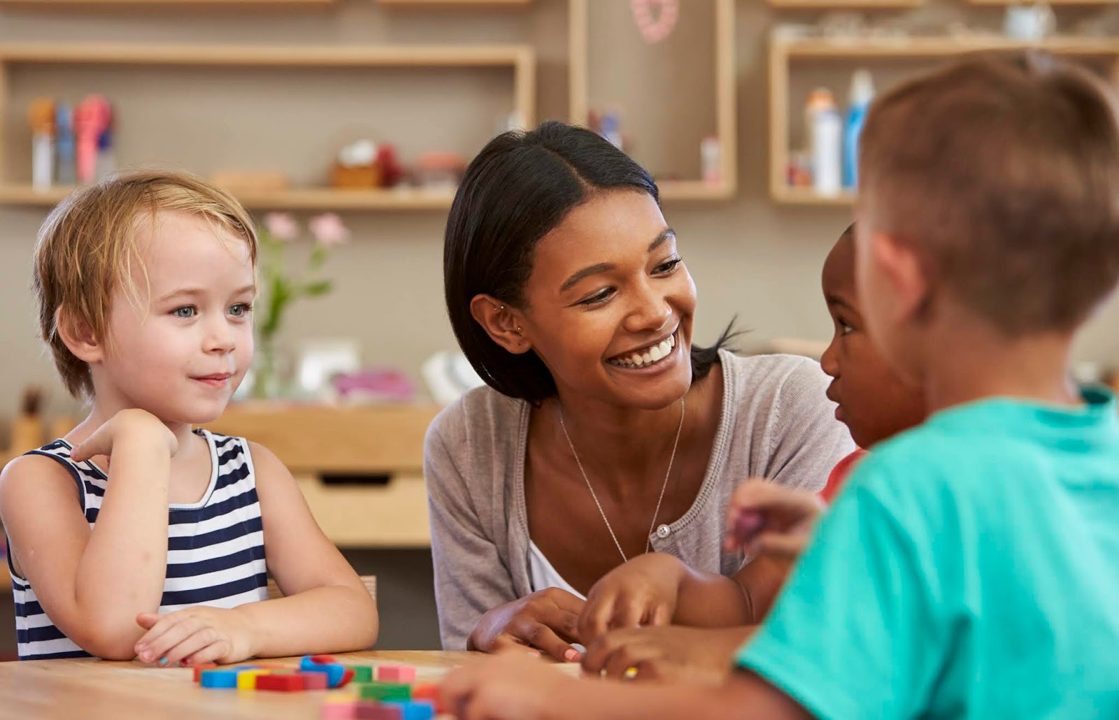 NAMC montessori educating the whole child teacher and children working together.