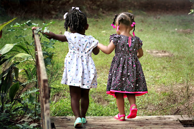 NAMC International Day for Tolerance Peace in the Montessori Environment girls walking.