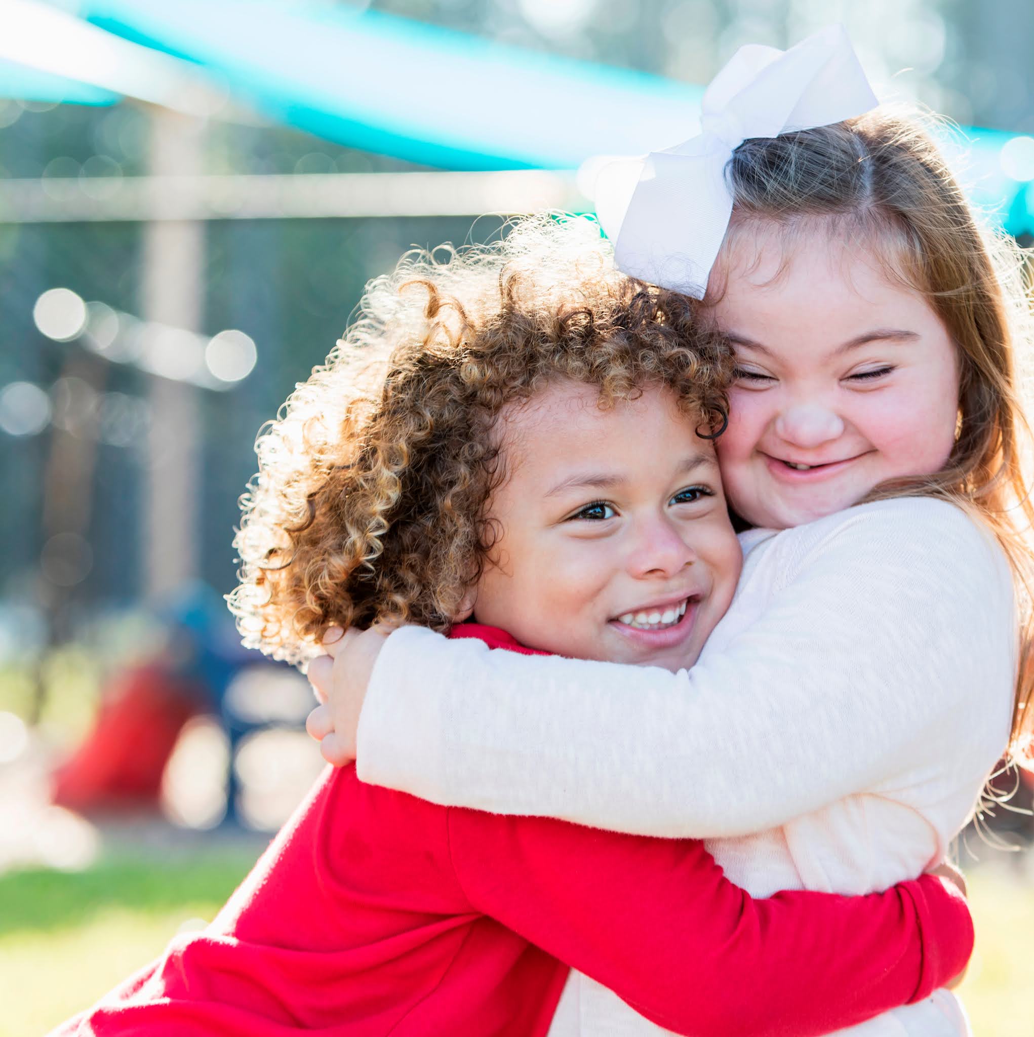 cosmic education. a blueprint for peace. children hugging.