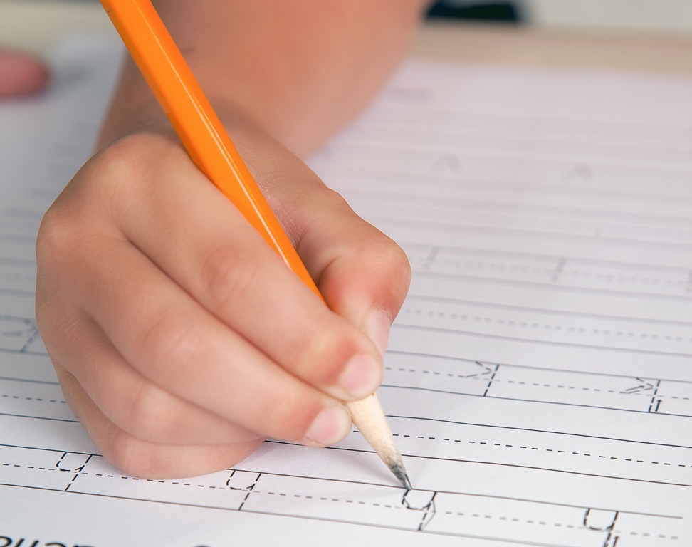 namc studying montessori today lillard ch 2 primary years. child tracing letters with pencil