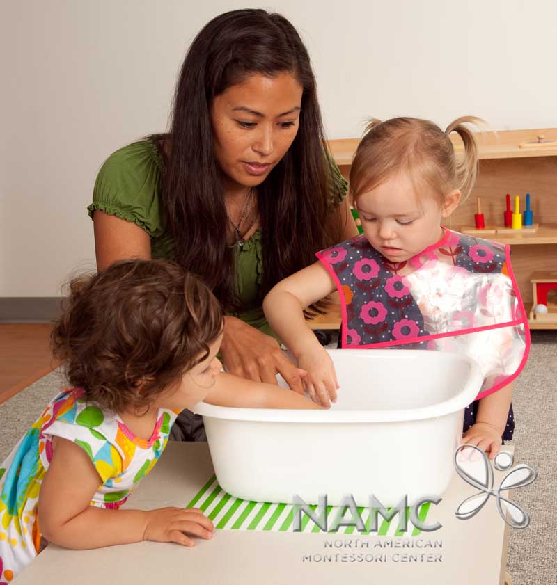 NAMC circle of inclusion montessori materials built in control of error. girls and teacher with water activity