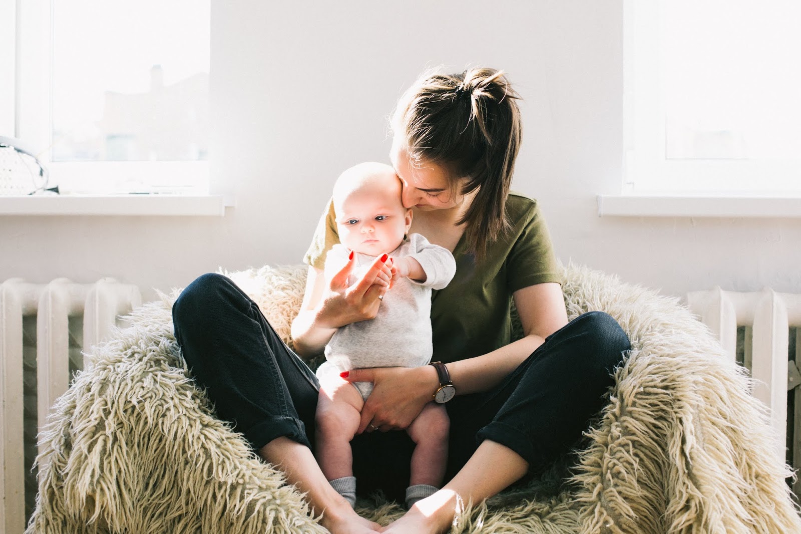 NAMC montessori parenting with a disability woman holding a baby
