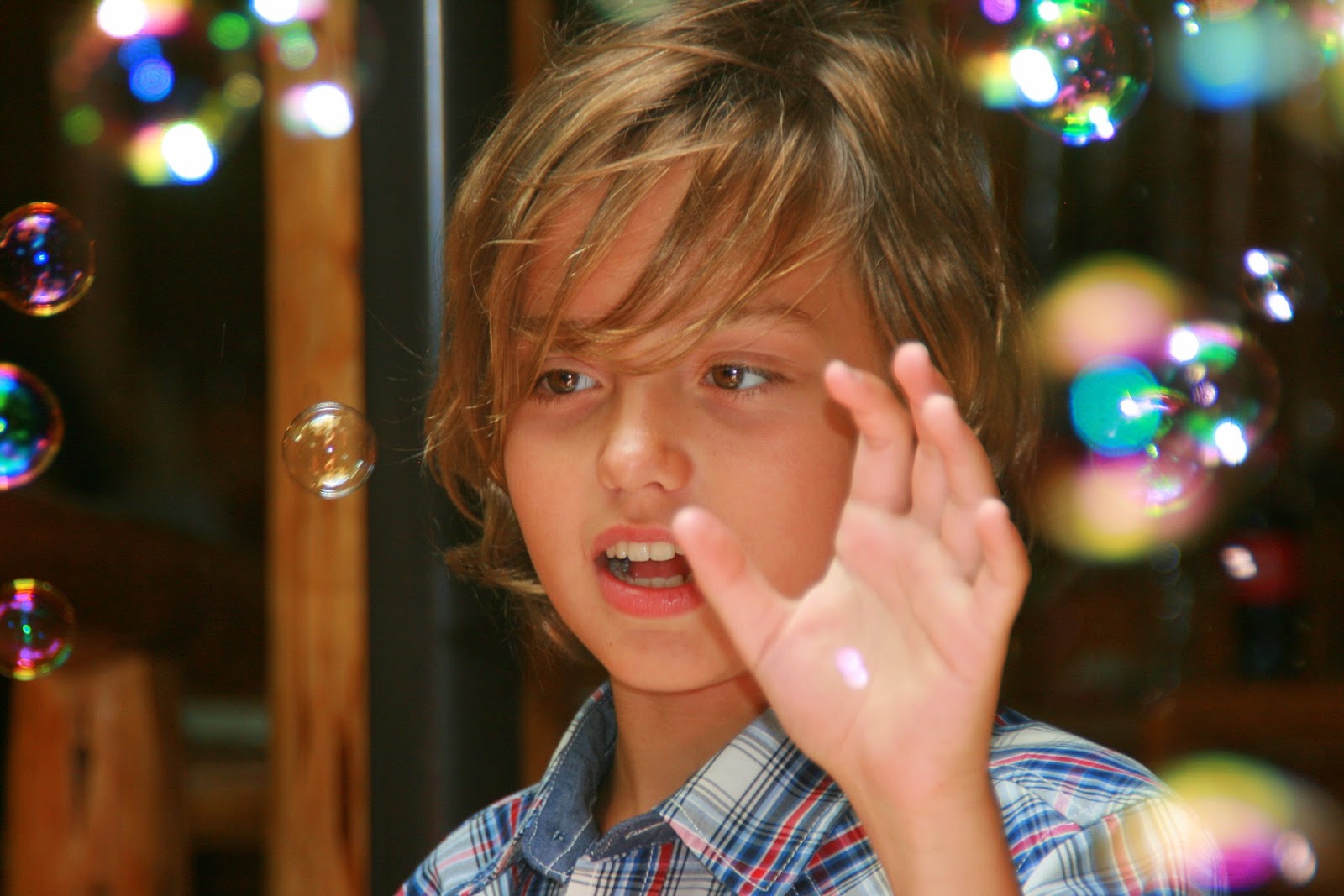 NAMC montessori working with gifted child boy with bubbles