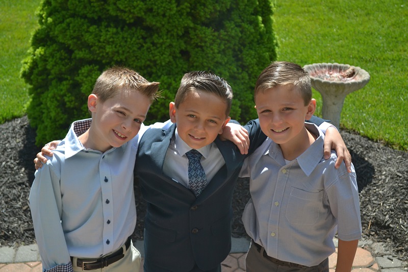 NAMC montessori second plane of development, the age of morals and ethical thinking. Boys standing together.