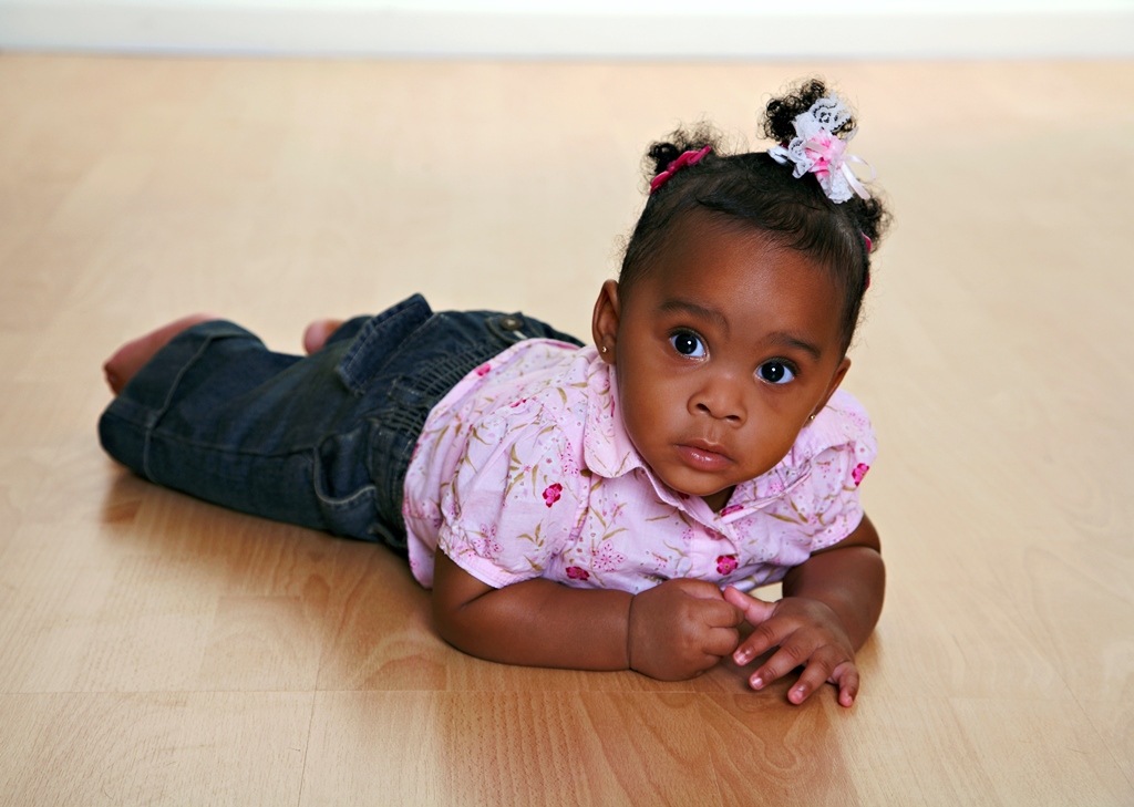 namc studying montessori today lillard ch 2 primary years. young girl crawling on floor