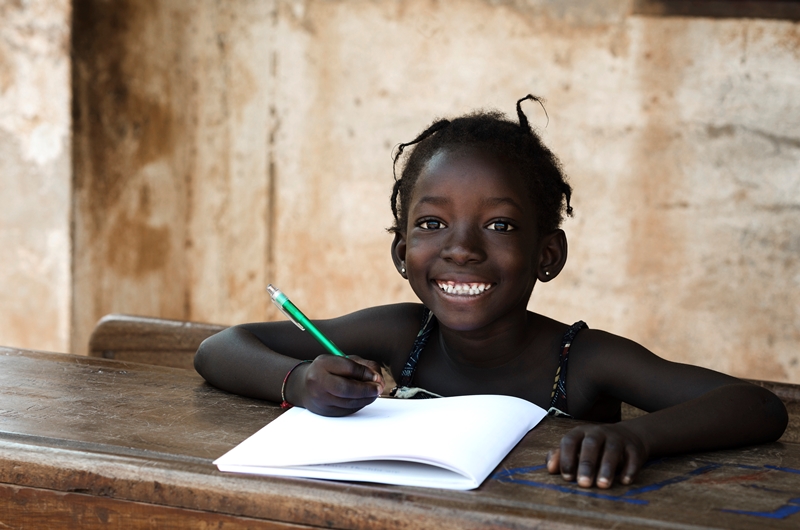 NAMC montessori educating the whole child girl writing in notebook
