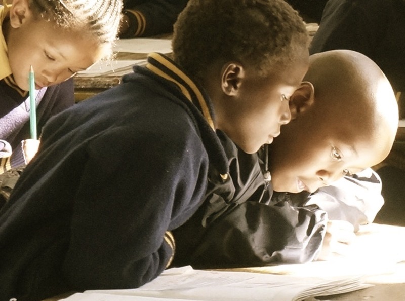 namc montessori mixed age group benefits. children working and reading together
