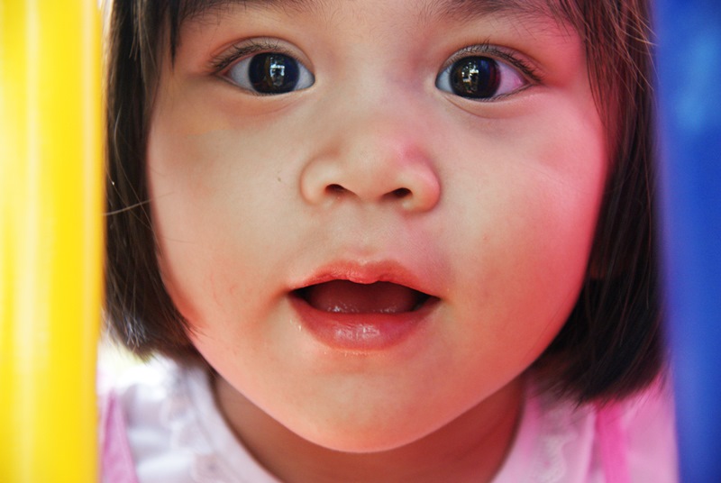 NAMC montessori classroom children with special needs. Smiling young asian girl
